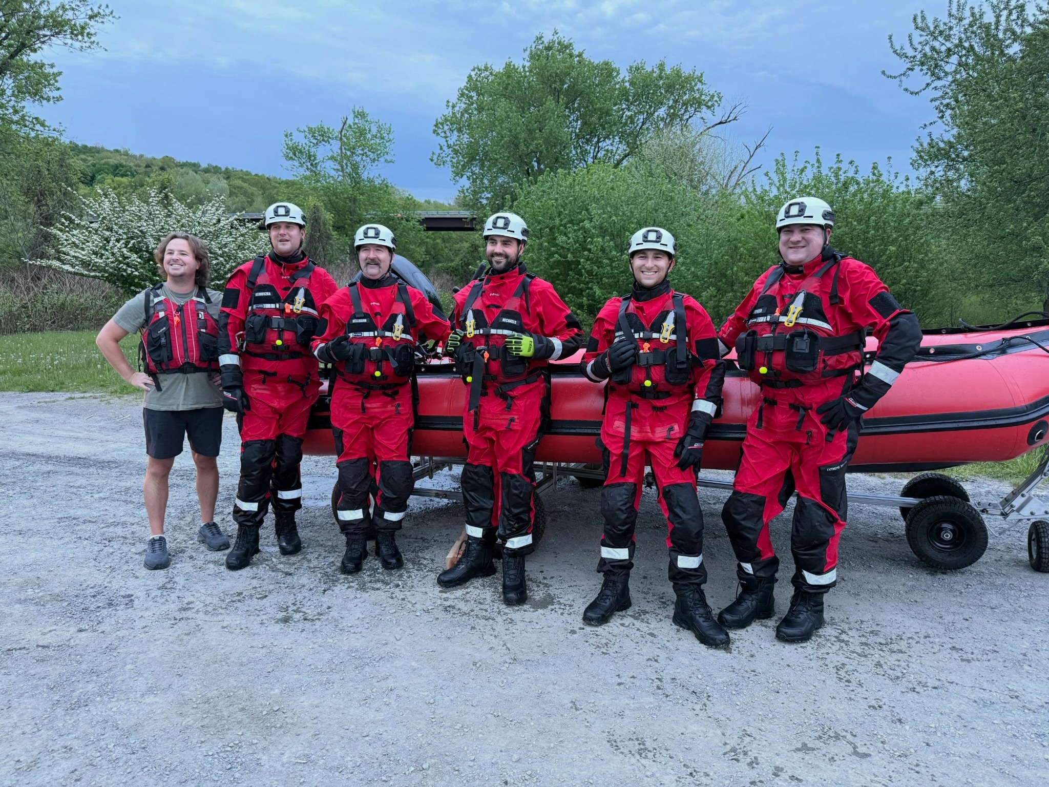 Apalachin swiftwater rescue members gathered beside their rescue boat